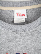Disney Fleece Grau L – Etikett