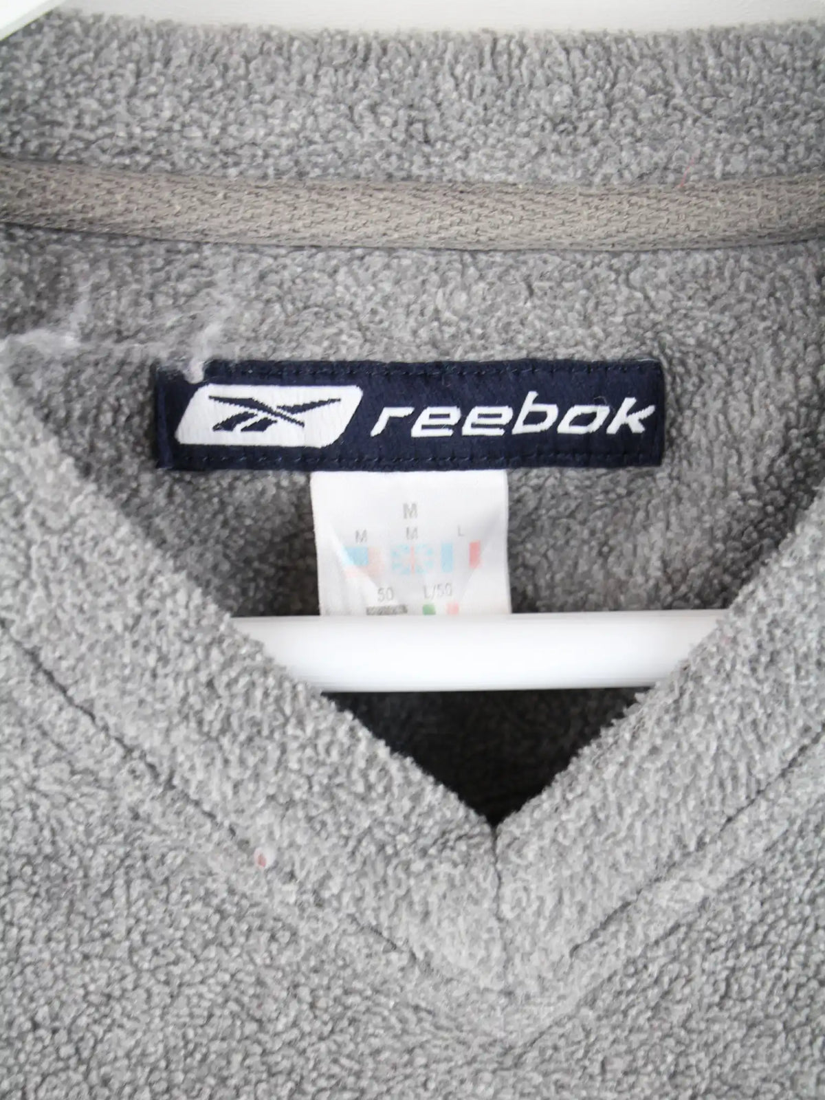 Reebok Fleece Grau M – Etikett