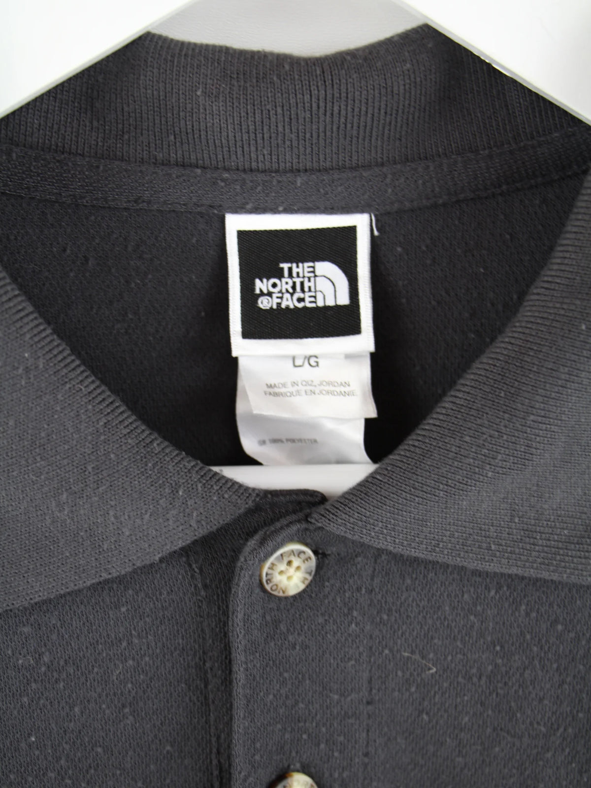 The North Face Polo Grau L – Etikett